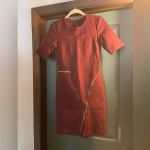 Burgundy fitted dress with gold zipper detailing